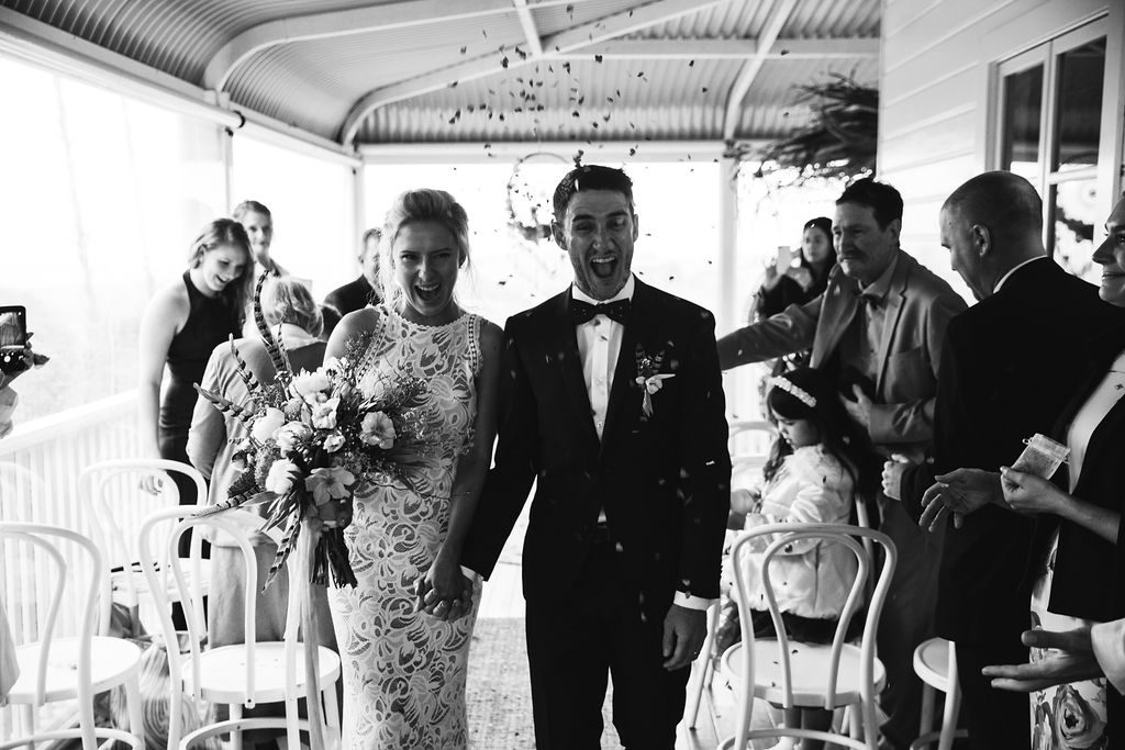 Bride and groom walking down isle / Wedding Photography