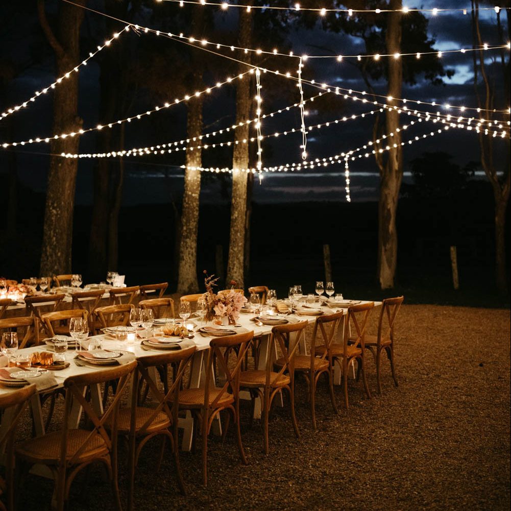 Reception table decorations with fairy lights / Byron Bay wedding