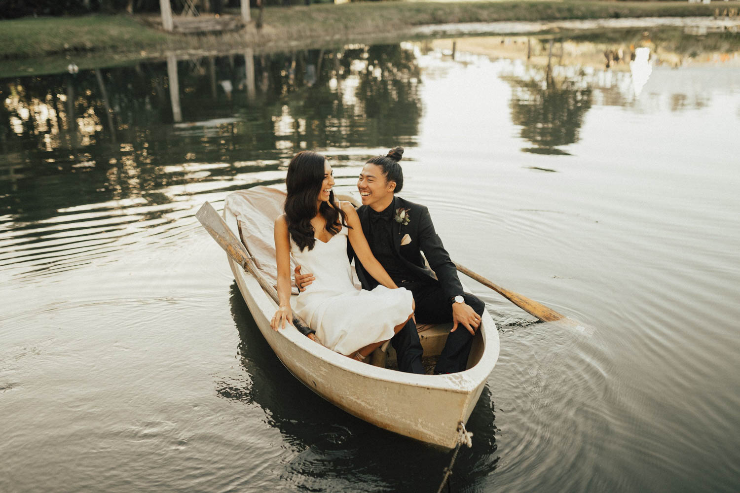 Bride and groom in boat / wedding photography