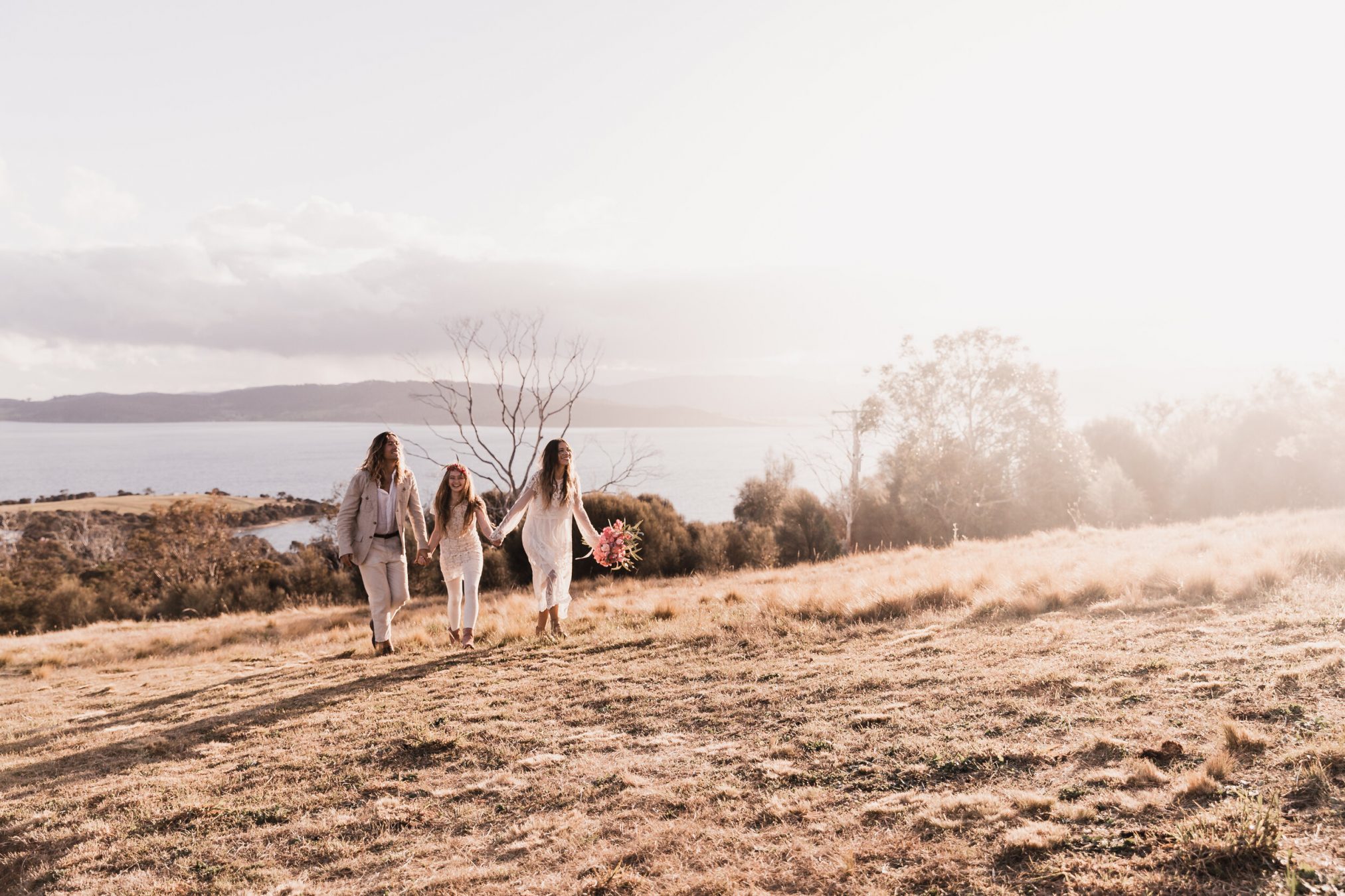 Bride, groom with family in Tasmanian hilltop