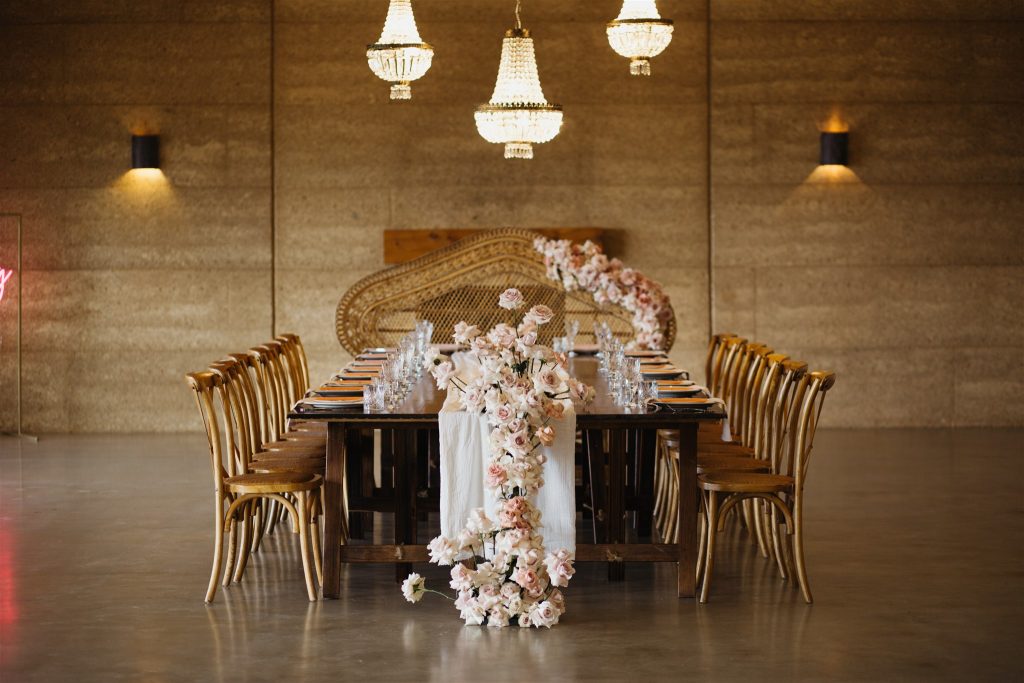 Reception table set up with flowers in Byron Bay